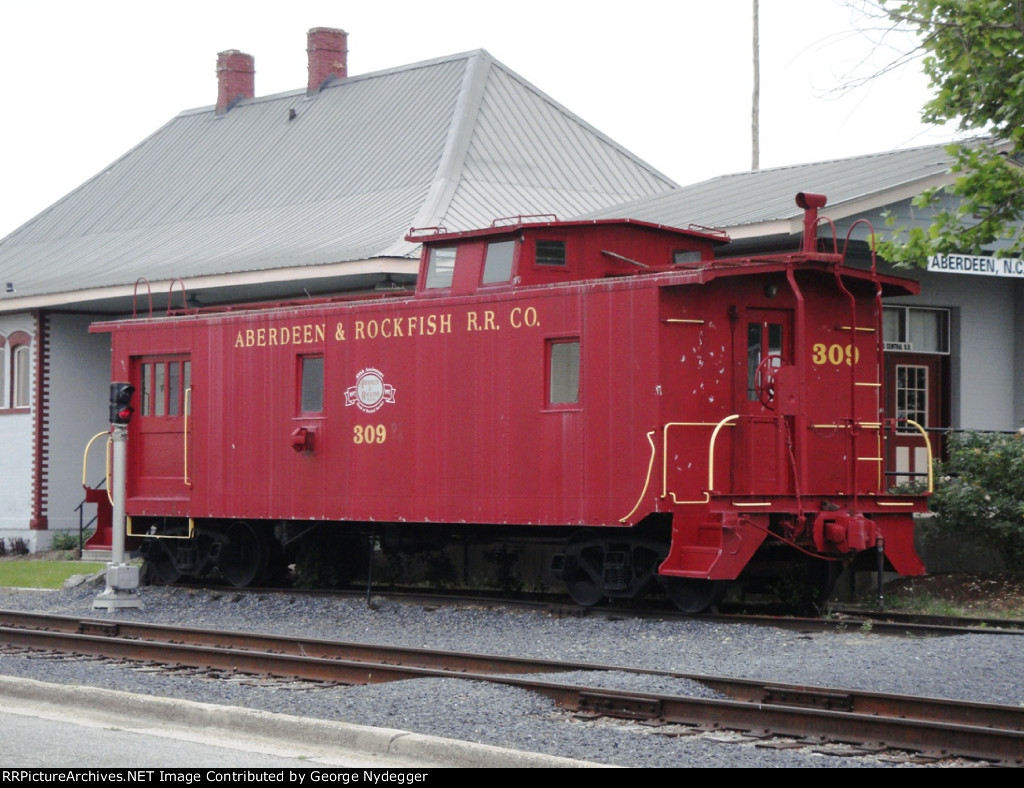 AR 309 Caboose at the Station 